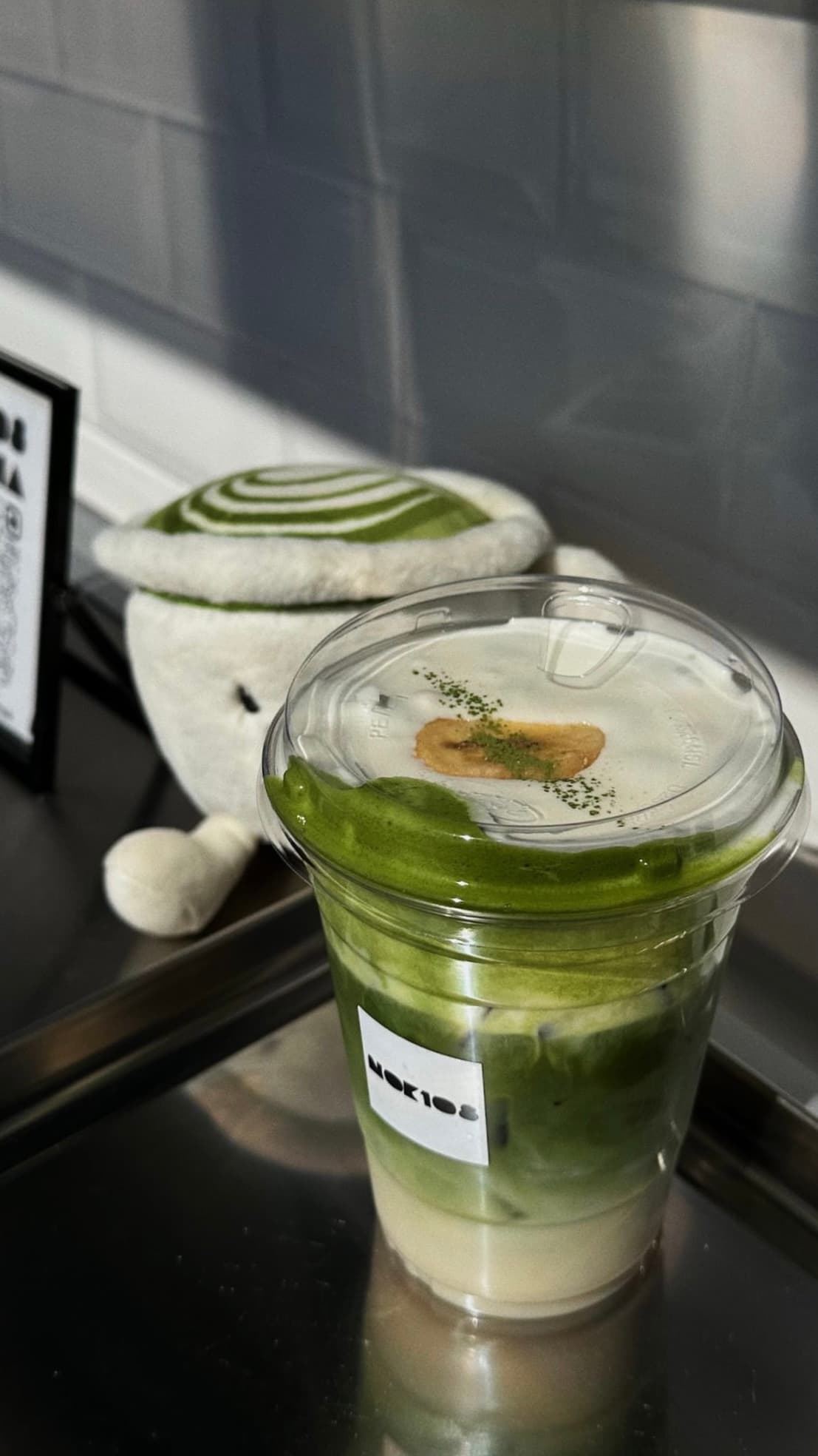 Matcha latte with turtle plushie