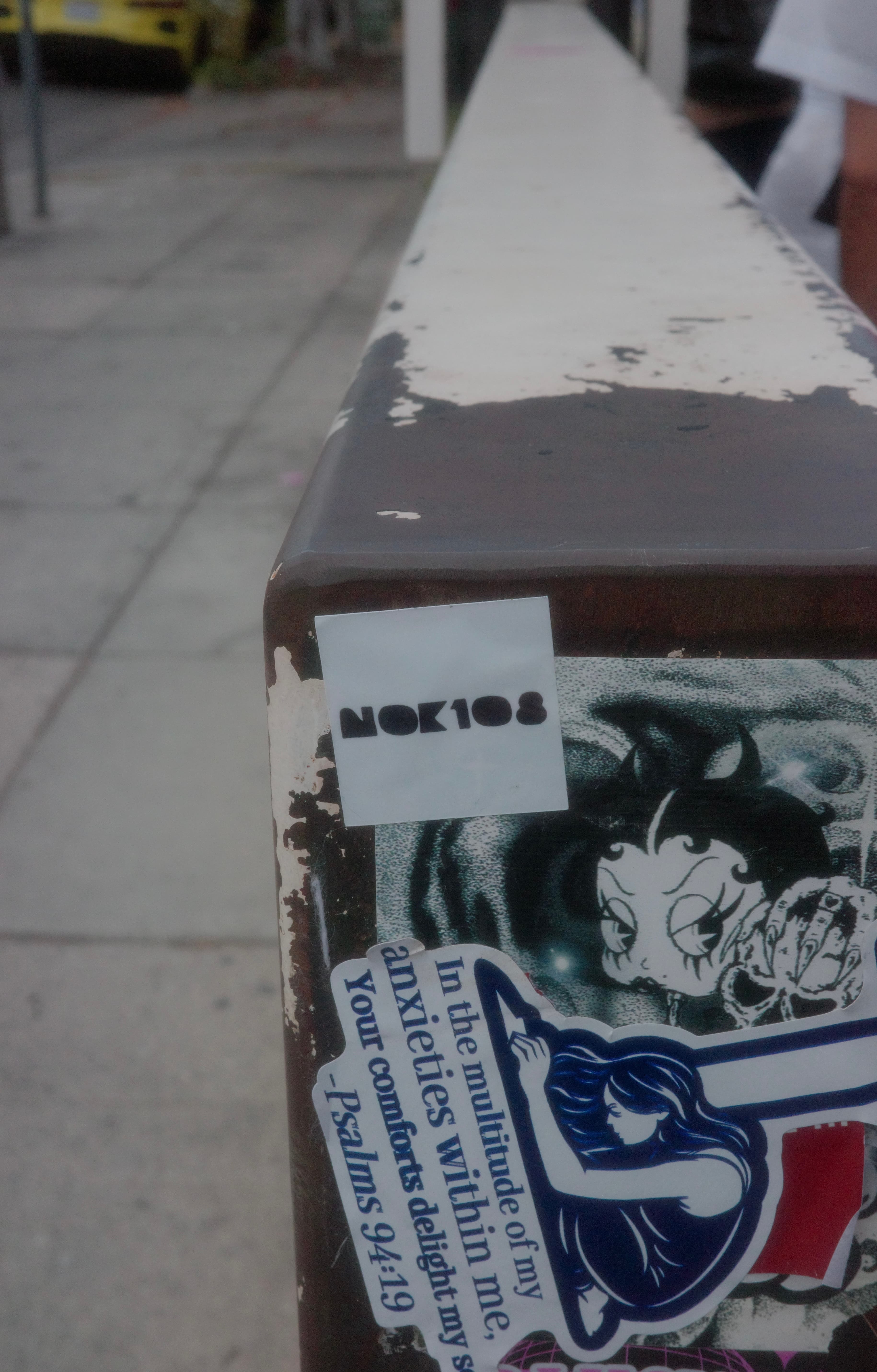 NOK108 sticker on street box